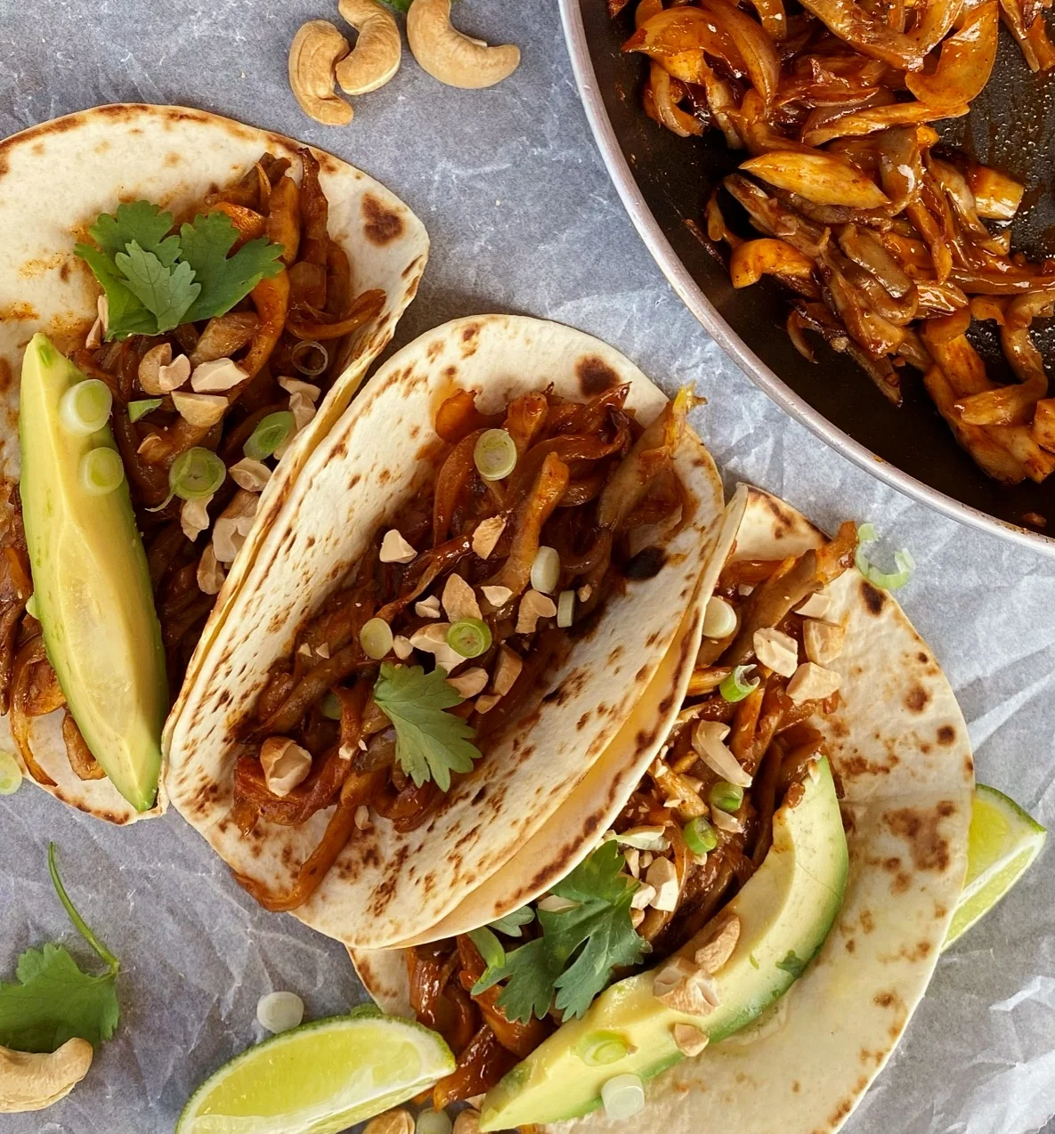 Tacos filled with vegetables, avocado and herbs