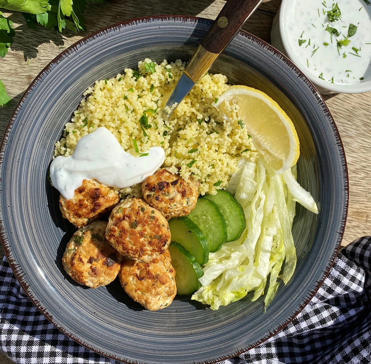 A balanced bowl with grains, vegetables and fritters